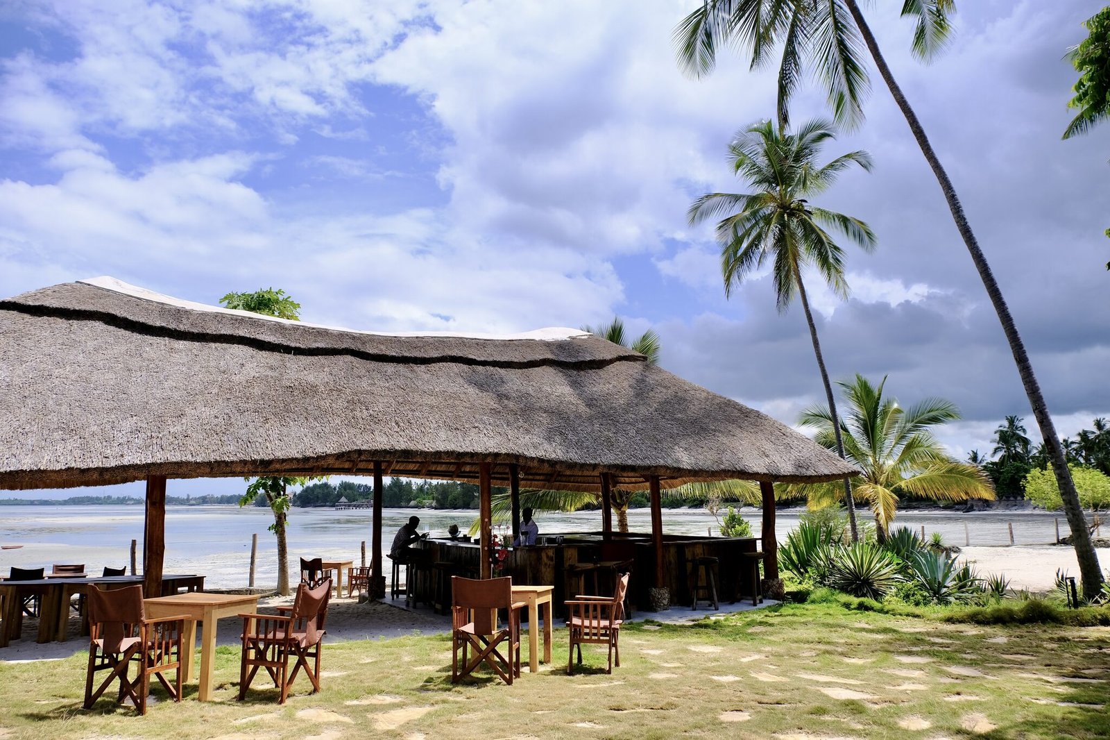 Thatched beach bar on the white sand at Uroa