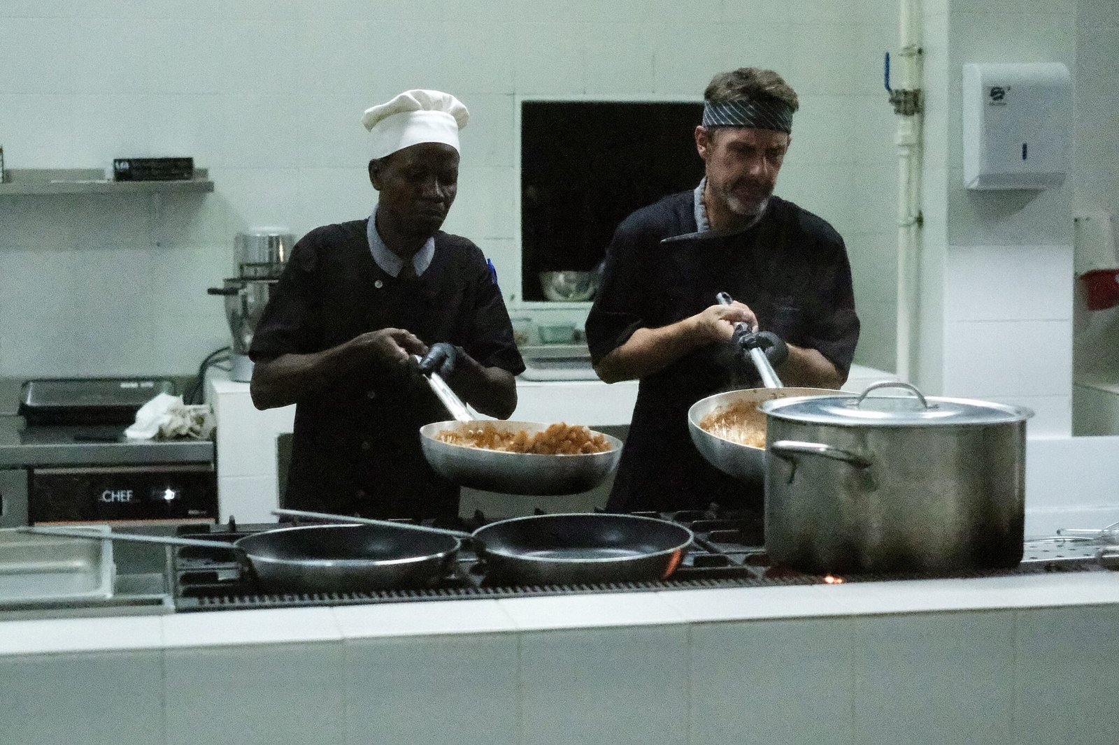 Chefs preparing dishes in the Maharaja kitchen