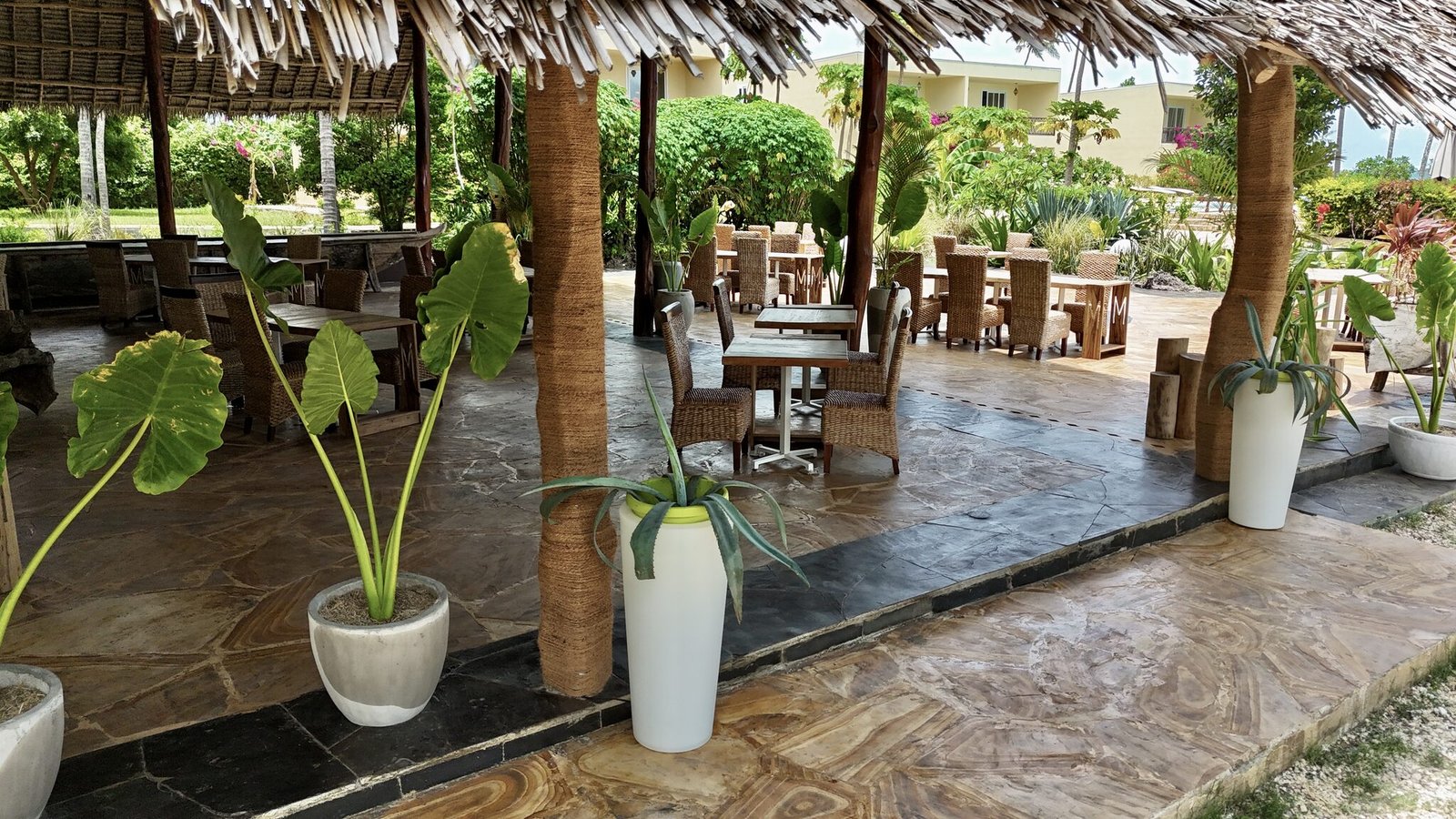 Restaurant seating with views over the pool and gardens