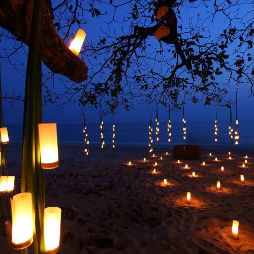 Romantic candlelit dinner on the beach